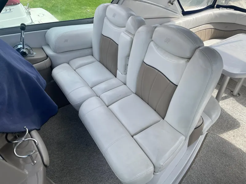 Slide: The Image of Interior of a 2005 Four Winns 348 Vista with beige leather seating. - 9