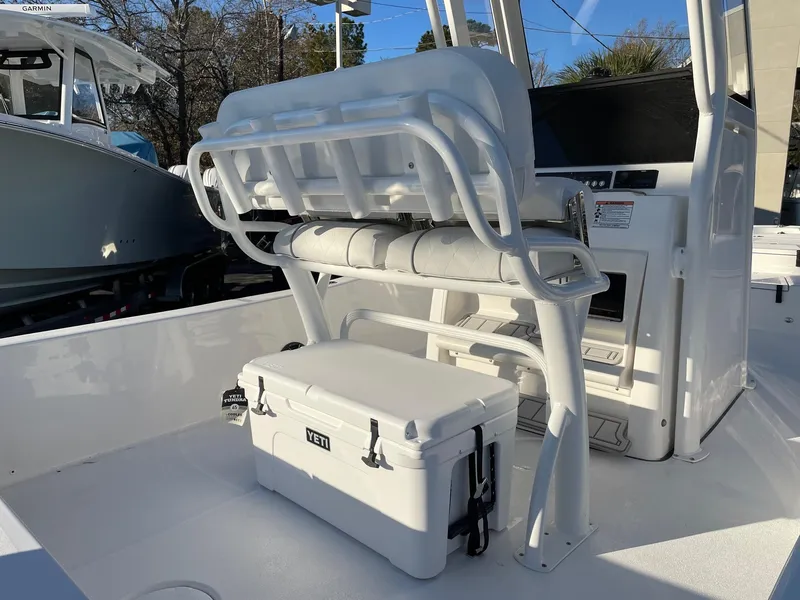 Slide: The Image of 2024 Sea Fox 251 Bay Fox boat interior with seating and Yeti cooler. - 13