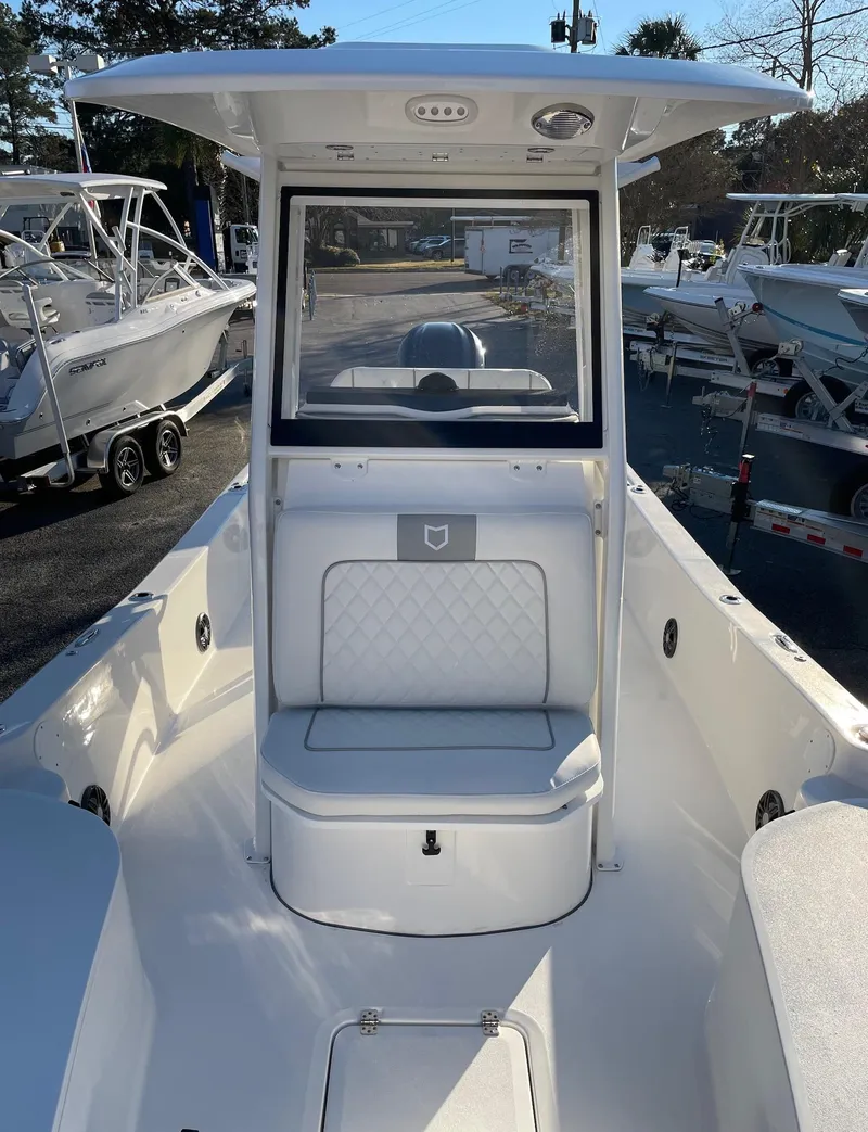 Slide: The Image of 2024 Sea Fox 251 Bay Fox boat interior with seating and console. - 17