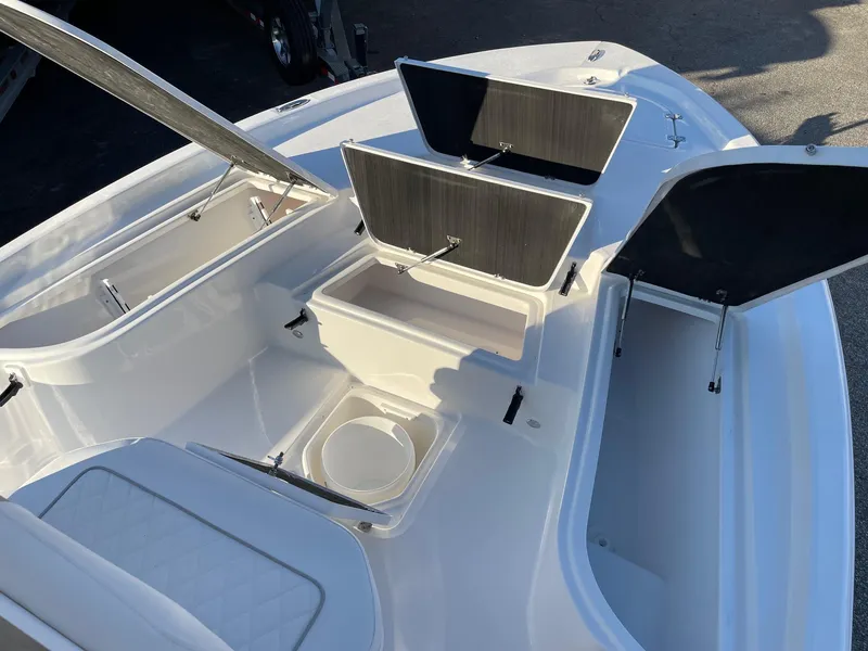 Slide: The Image of 2024 Sea Fox 251 Bay Fox boat with open storage compartments. - 23
