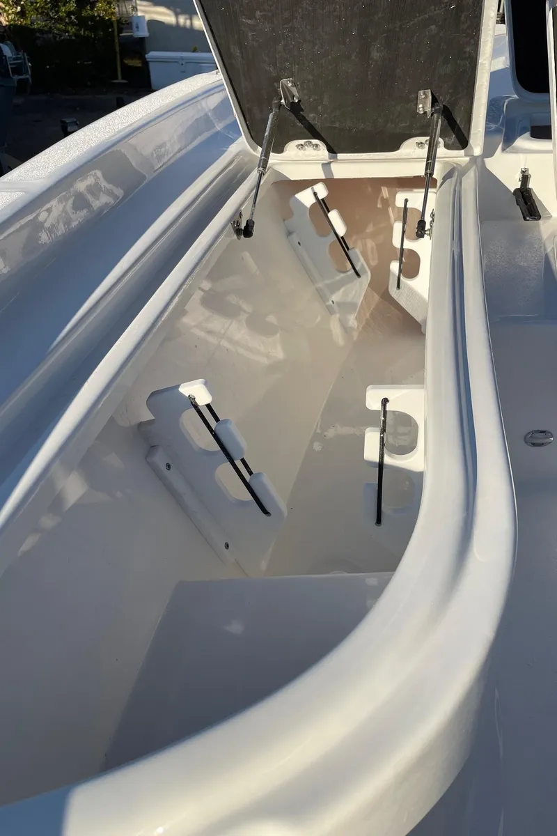 Slide: The Image of 2024 Sea Fox 251 Bay Fox open storage compartment. - 24