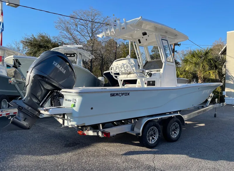 Slide: The Image of 2024 Sea Fox 251 Bay Fox boat on a trailer with Yamaha outboard motor. - 3