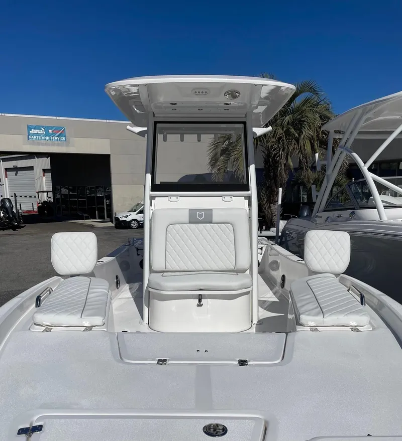 Slide: The Image of 2024 Sea Fox 251 Bay Fox boat with white seating and center console. - 7