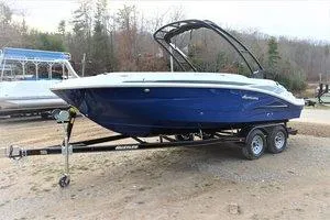 Slide: The Image of 2023 Hurricane SUNDECK SPORT 205 I/O boat on a trailer in an outdoor setting. - 5