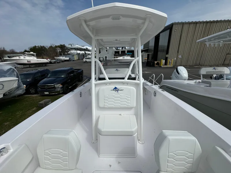 Slide: The Image of 2024 Aquasport 2200 CC center console boat with seating and T-top. - 11