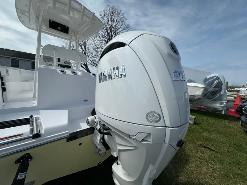 Slide: The Image of 2024 Aquasport 2200 CC boat with Yamaha outboard motor. - 13
