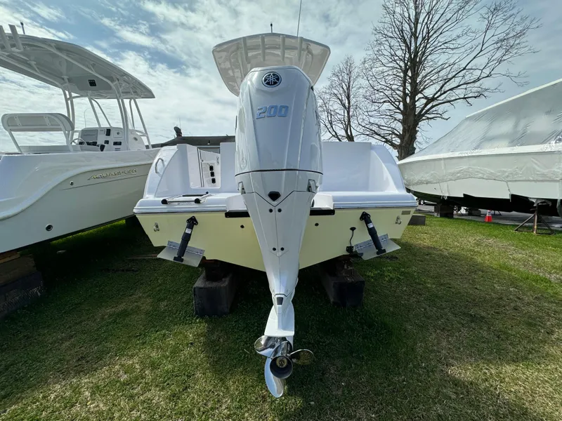 Slide: The Image of 2024 Aquasport 2200 CC boat with outboard motor on display. - 3