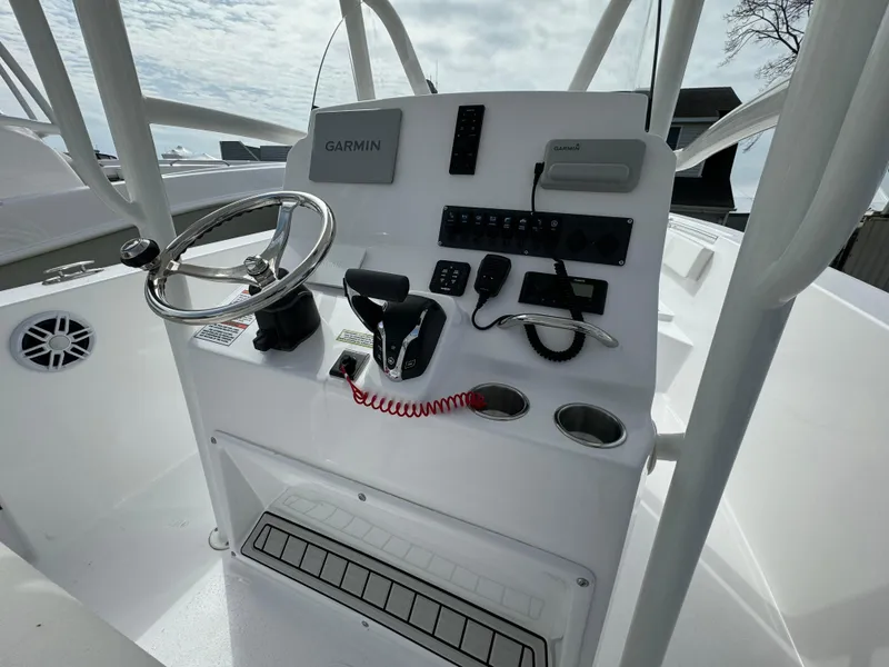 Slide: The Image of 2024 Aquasport 2200 CC boat console with Garmin navigation system. - 8