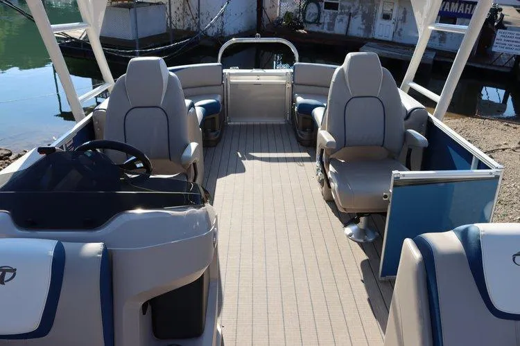 Slide: The Image of 2022 Tahoe Pontoon LTZ 2485 QL interior with spacious seating and modern design. - 10