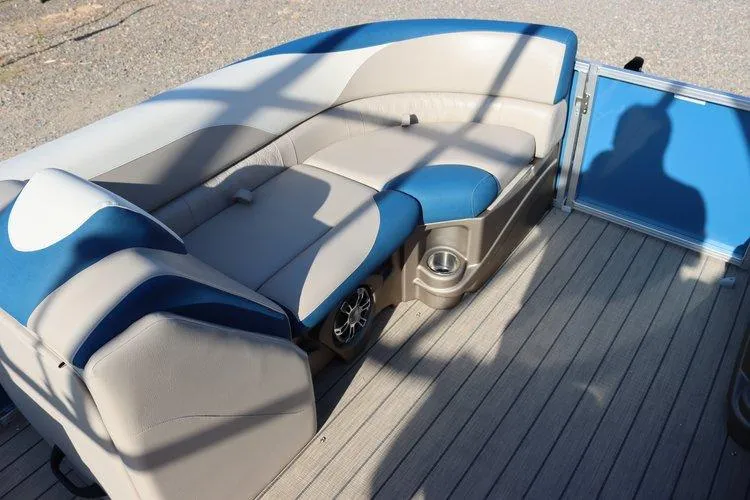 Slide: The Image of 2022 Tahoe Pontoon LTZ 2485 QL interior with blue and beige seating. - 13