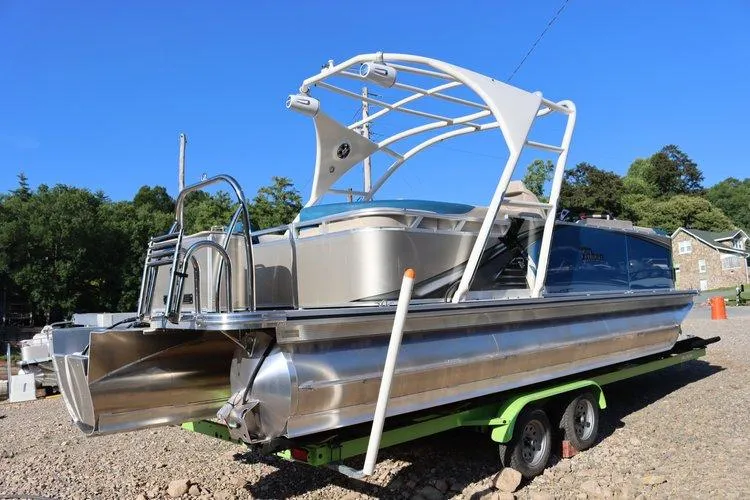 Slide: The Image of 2022 Tahoe Pontoon LTZ 2485 QL on a trailer, ready for launch. - 14