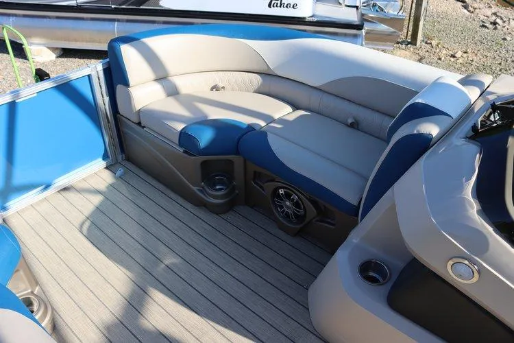 Slide: The Image of 2022 Tahoe Pontoon LTZ 2485 QL interior with cushioned seating and speaker system. - 15