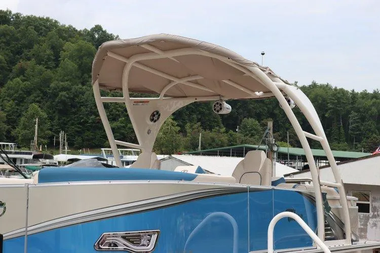 Slide: The Image of 2022 Tahoe Pontoon LTZ 2485 QL with canopy at a marina. - 19