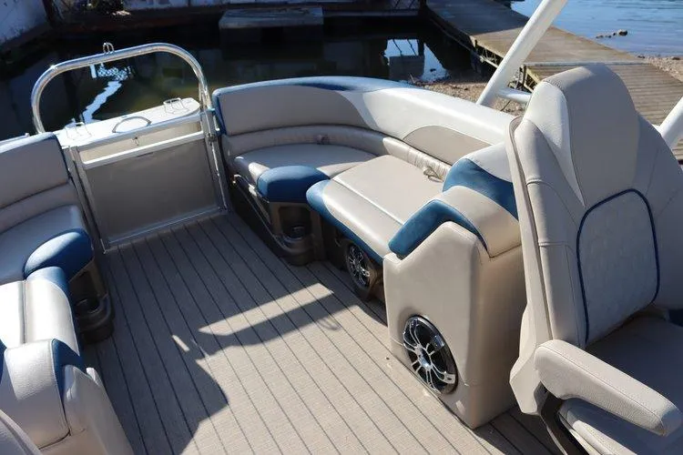 Slide: The Image of 2022 Tahoe Pontoon LTZ 2485 QL interior with plush seating and modern design. - 6