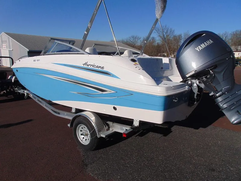 Slide: The Image of 2024 Hurricane SunDeck 191 OB boat with Yamaha outboard motor on trailer. - 2