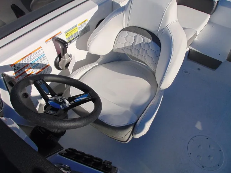 Slide: The Image of 2024 Hurricane SunDeck 191 OB boat captain's chair and steering wheel. - 7