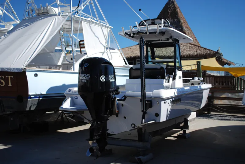 Slide: The Image of 2021 Everglades 253 boat with outboard motor in a marina. - 15