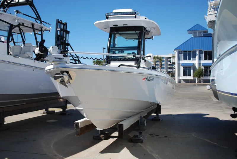 Slide: The Image of 2021 Everglades 253 boat docked at a marina, front view. - 6