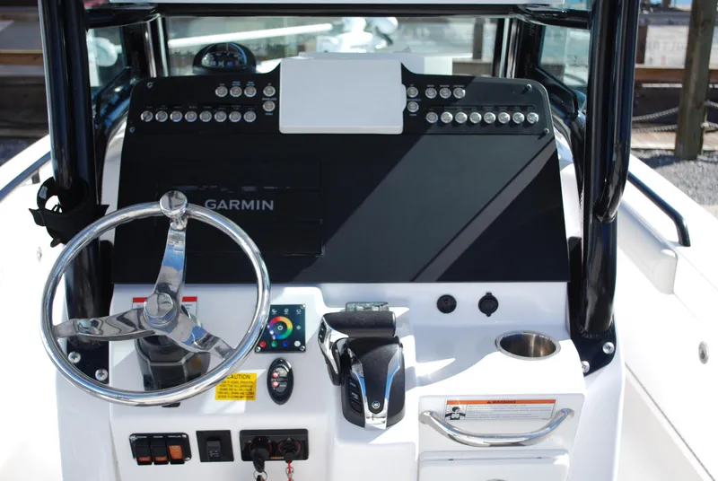 Slide: The Image of 2021 Everglades 253 boat dashboard with Garmin navigation system and steering wheel. - 7