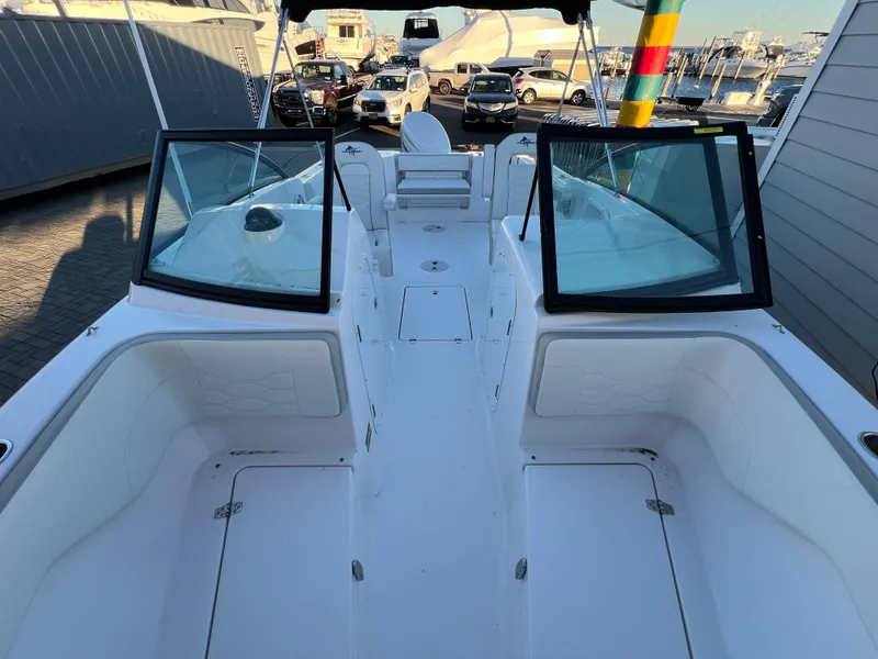 Slide: The Image of 2024 Aquasport 2200 DC boat interior with open deck and seating. - 15