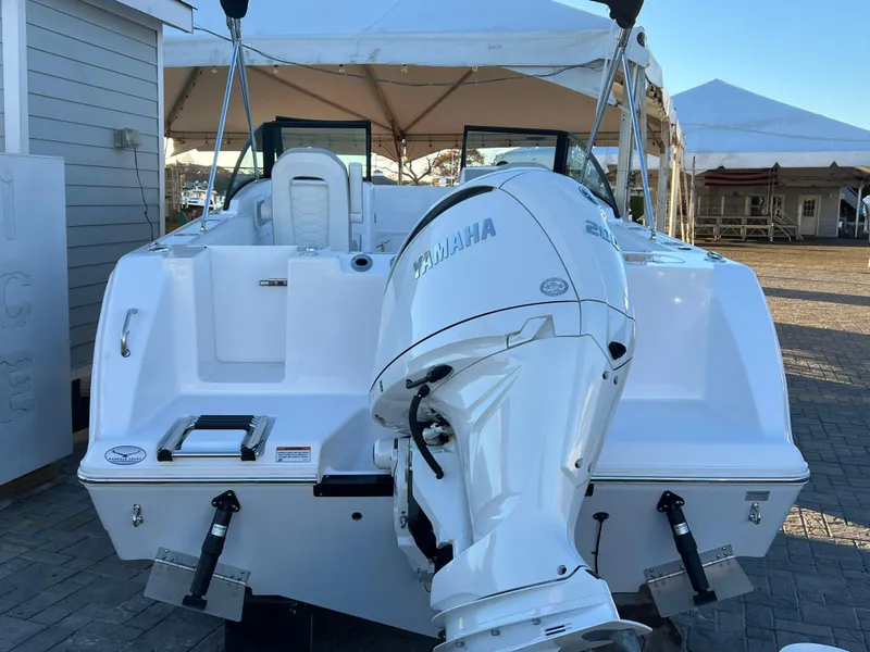 Slide: The Image of 2024 Aquasport 2200 DC boat with Yamaha outboard motor, displayed outdoors. - 6