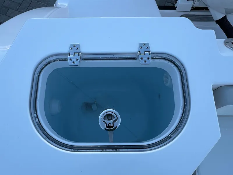 Slide: The Image of 2024 Aquasport 2200 DC livewell with clear lid and stainless steel hinges. - 9