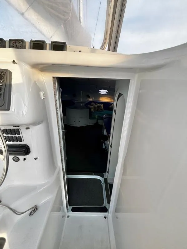 Slide: The Image of Interior view of a 1991 Custom Morelli-Miller boat, showing cabin entrance and control panel. - 24