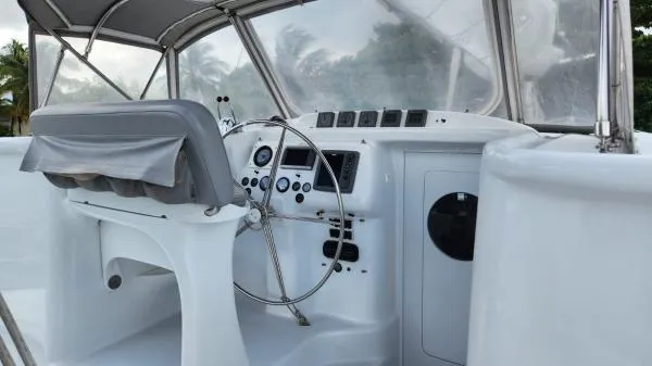 Slide: The Image of 1991 Custom Morelli-Miller boat cockpit with steering wheel and control panel. - 25
