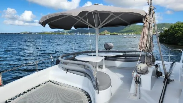 Slide: The Image of 1991 Custom Morelli-Miller boat with shaded seating, scenic water and mountain backdrop. - 29