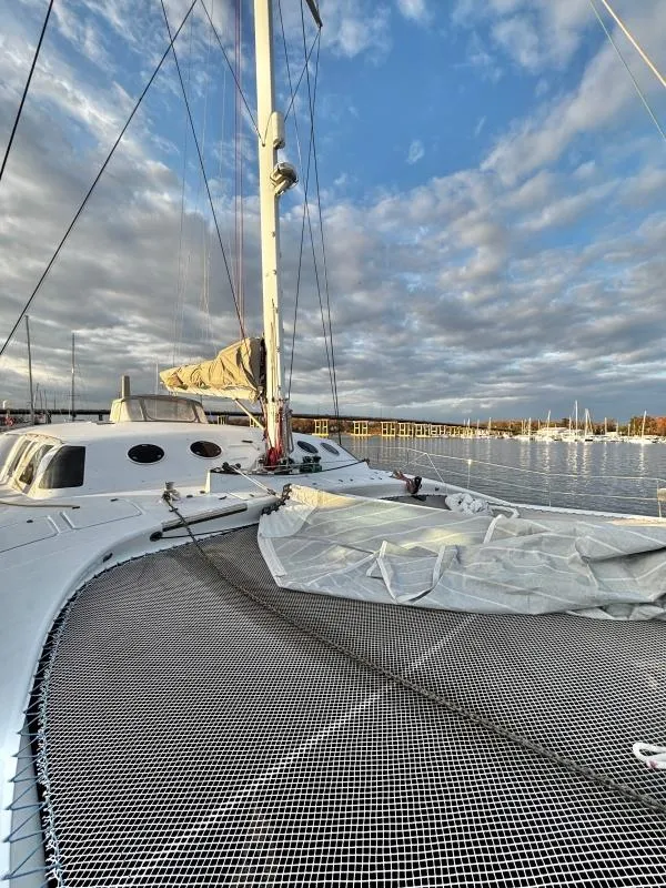 Slide: The Image of Sailboat on calm water, Custom Morelli-Miller 1991, under a partly cloudy sky. - 35