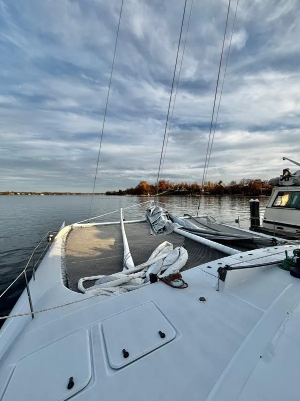 Slide: The Image of Sailboat deck view, Custom Morelli-Miller 1991, calm waters, cloudy sky. - 37