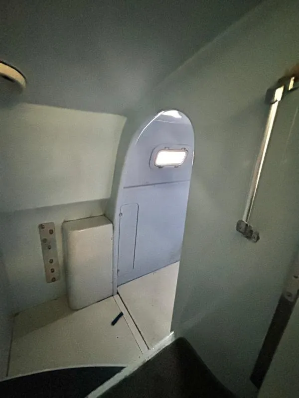 Slide: The Image of Interior of a 1991 Custom Morelli-Miller vehicle, featuring a compact, minimalist design. - 46