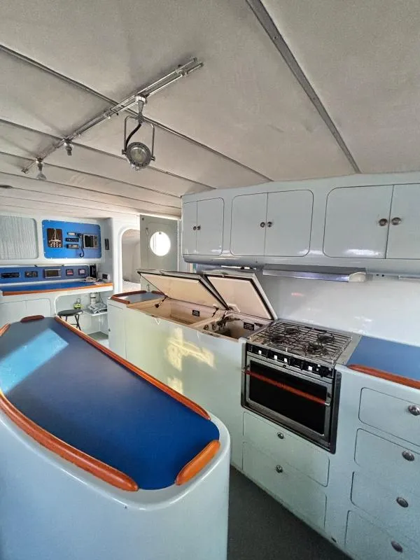 Slide: The Image of Interior of a 1991 Custom Morelli-Miller yacht kitchen with modern appliances and sleek design. - 5