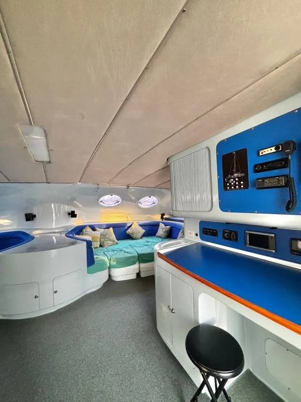 Slide: The Image of Interior of 1991 Custom Morelli-Miller yacht with seating area and navigation equipment. - 9