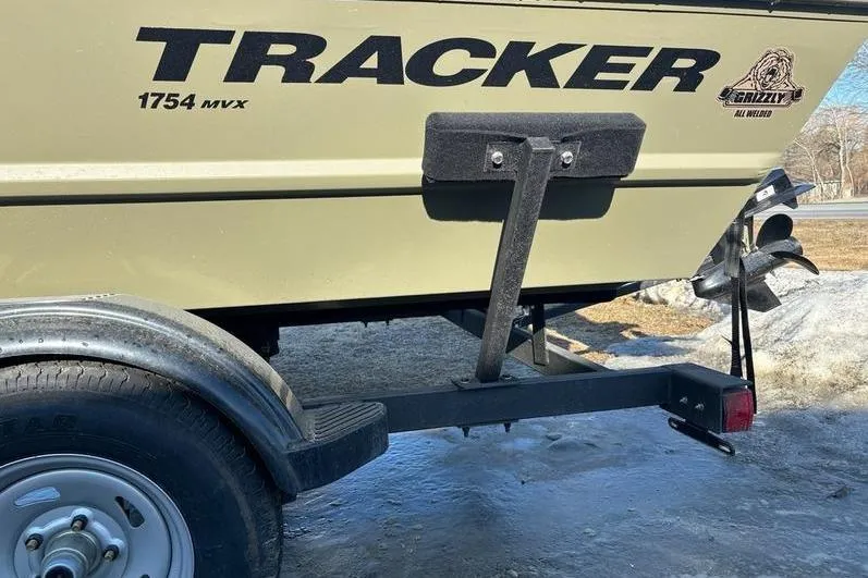 Slide: The Image of 2024 Tracker Grizzly 1754 SC boat on trailer, side view with logo visible. - 4