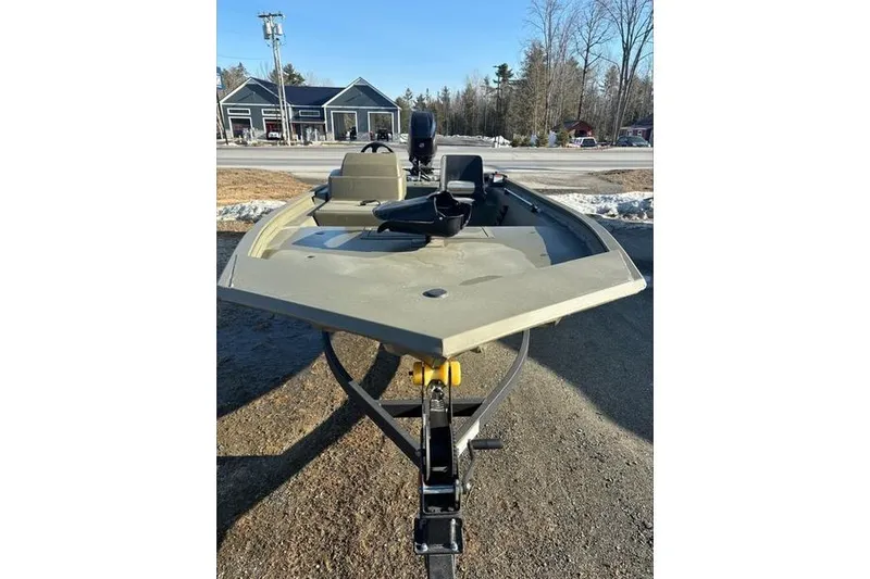 Slide: The Image of 2024 Tracker Grizzly 1754 SC boat on trailer, parked outdoors in a snowy setting. - 7