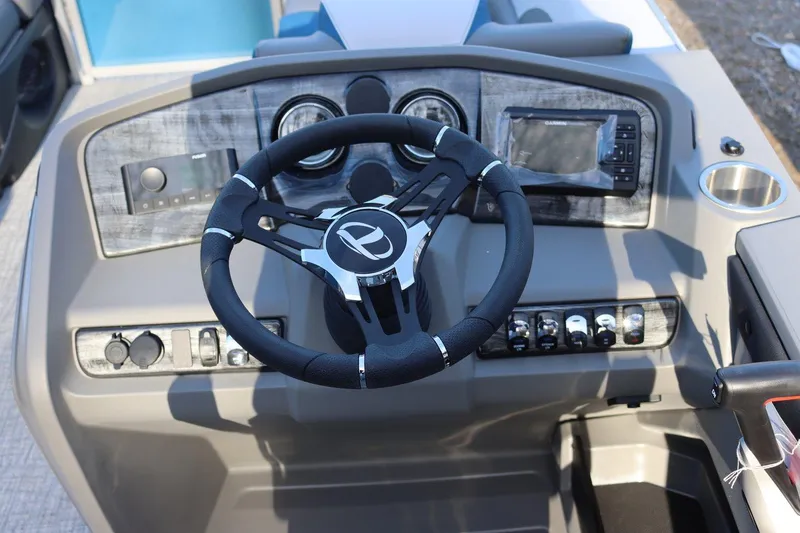 Slide: The Image of 2023 Tahoe Pontoon LT - 21' steering console with modern controls and navigation system. - 10
