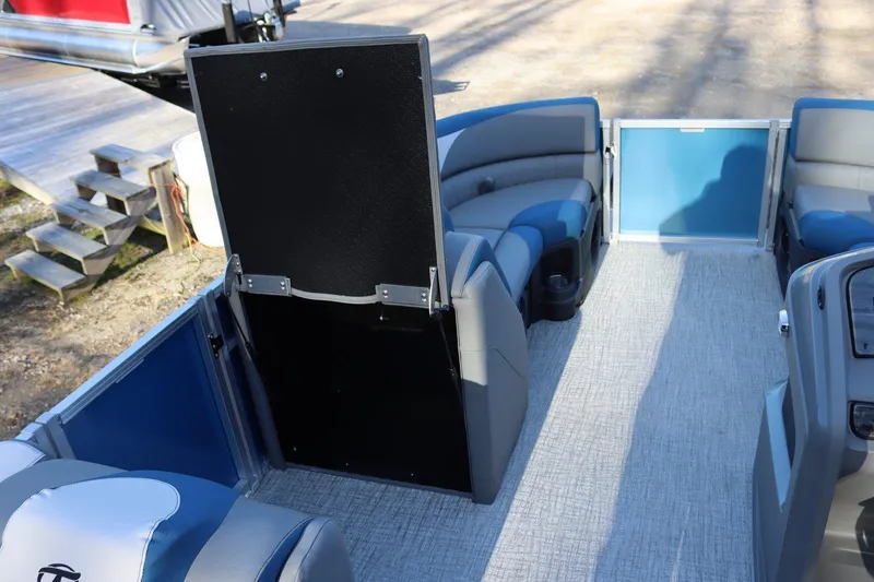 Slide: The Image of 2023 Tahoe Pontoon LT - 21' interior with seating and storage compartment. - 13