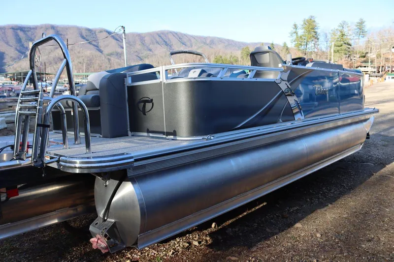 Slide: The Image of 2023 Tahoe Pontoon LT - 21' boat docked with scenic mountain background. - 16
