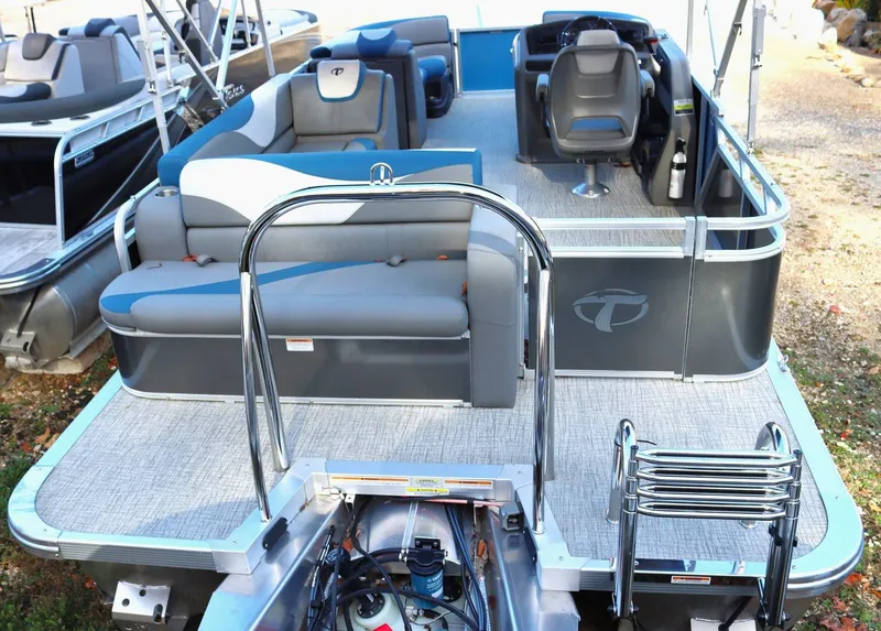 Slide: The Image of 2023 Tahoe Pontoon LT - 21' boat interior with seating and steering console. - 4