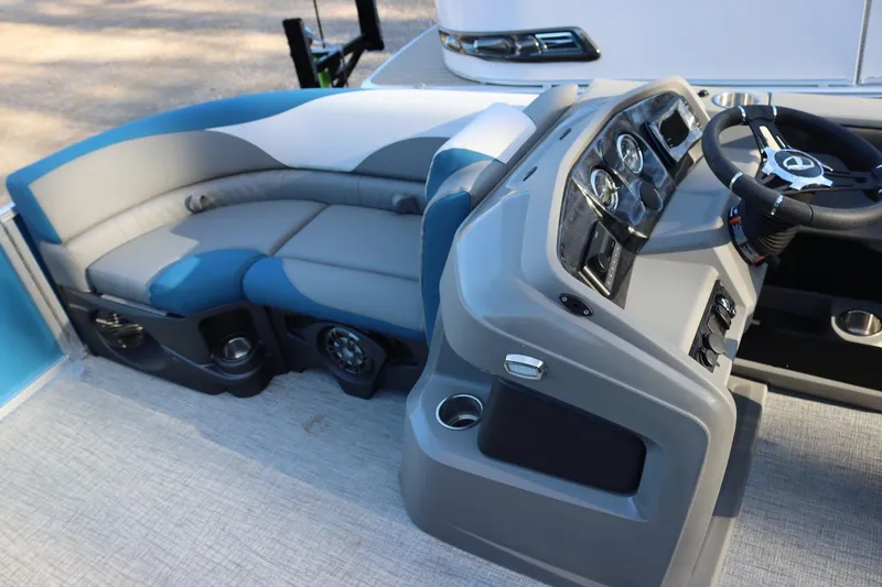 Slide: The Image of 2023 Tahoe Pontoon LT - 21' interior with steering console and cushioned seating. - 9