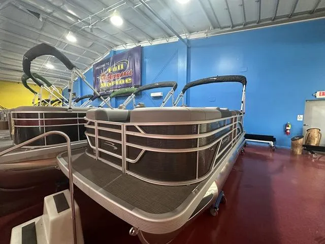 Slide: The Image of 2024 Bennington 188 SVL pontoon boat displayed indoors. - 11