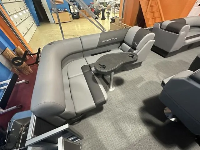 Slide: The Image of 2024 Bennington 188 SVL boat interior with gray seating and table. - 6