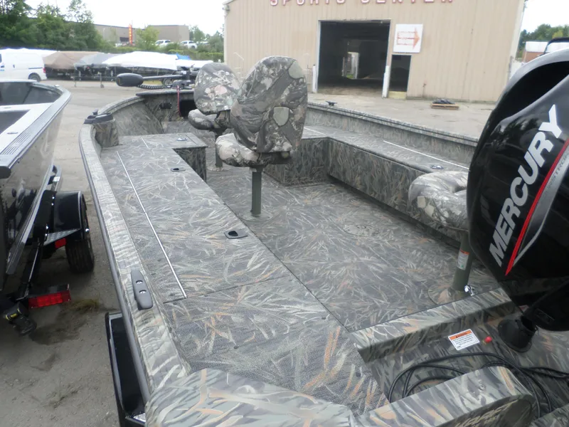 Slide: The Image of 2024 Polar Kraft OLV 165 T boat with camouflage interior and Mercury outboard motor. - 3