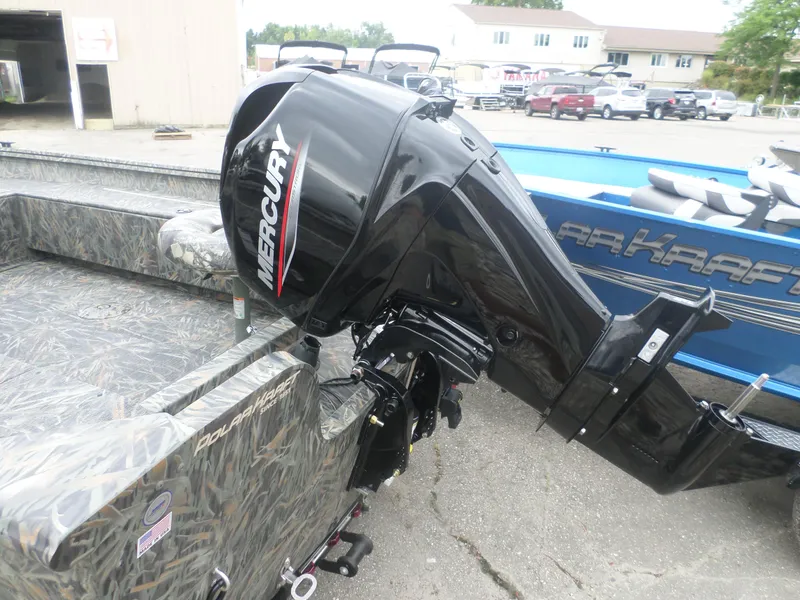 Slide: The Image of 2024 Polar Kraft OLV 165 T boat with Mercury outboard motor, camo design. - 4