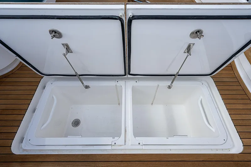 Slide: The Image of Open storage compartments on 2020 Viking 68 Convertible yacht. - 13