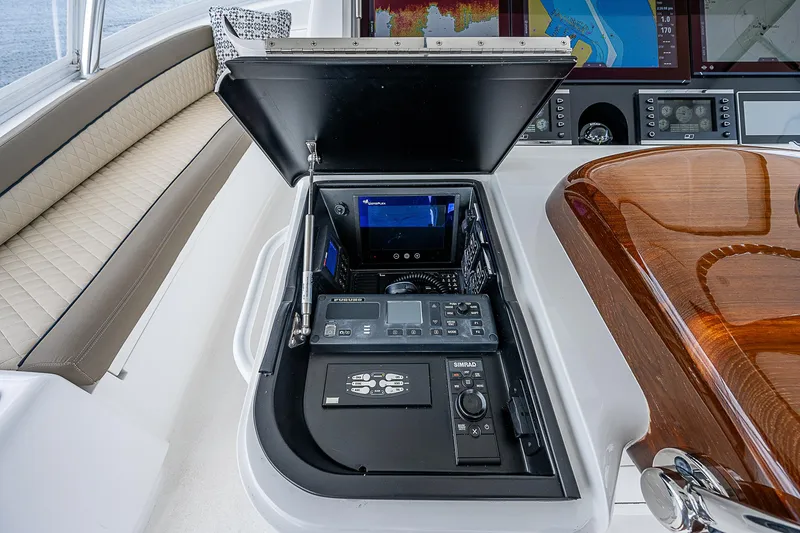 Slide: The Image of Control panel of a 2020 Viking 68 Convertible yacht with navigation equipment. - 16