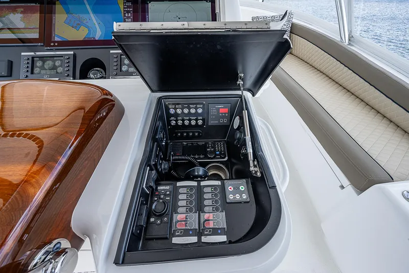 Slide: The Image of Control panel of a 2020 Viking 68 Convertible yacht with navigation equipment. - 18