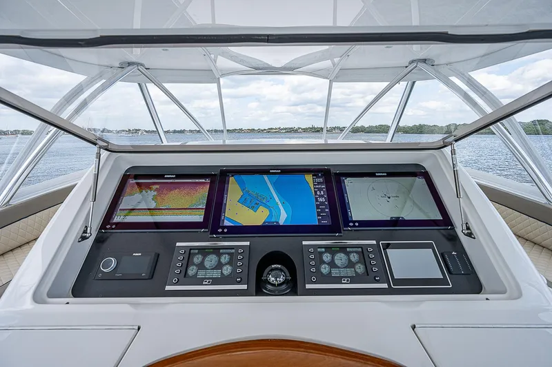 Slide: The Image of Control panel of a 2020 Viking 68 Convertible yacht with navigation screens. - 19
