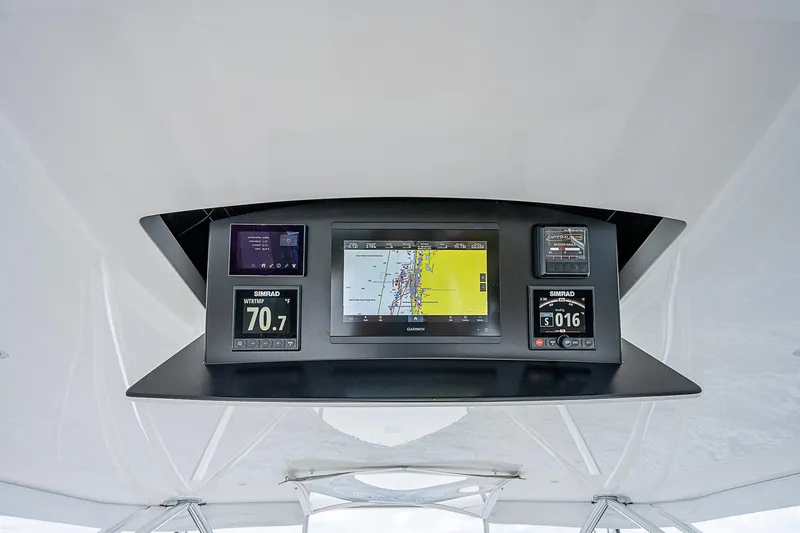 Slide: The Image of Viking 68 Convertible 2020 navigation system with multiple display screens. - 20